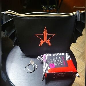 Jeffree Star bat bag NWOT with hoop earrings and Betset Johnson make up wipes.